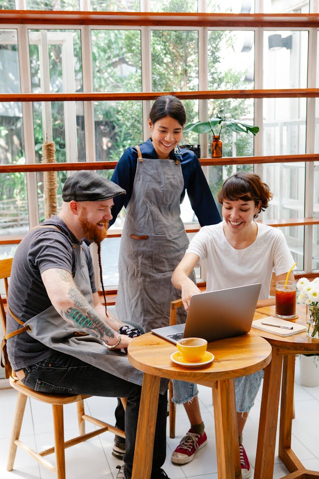 Friends viewing an online coffee shop on a laptop