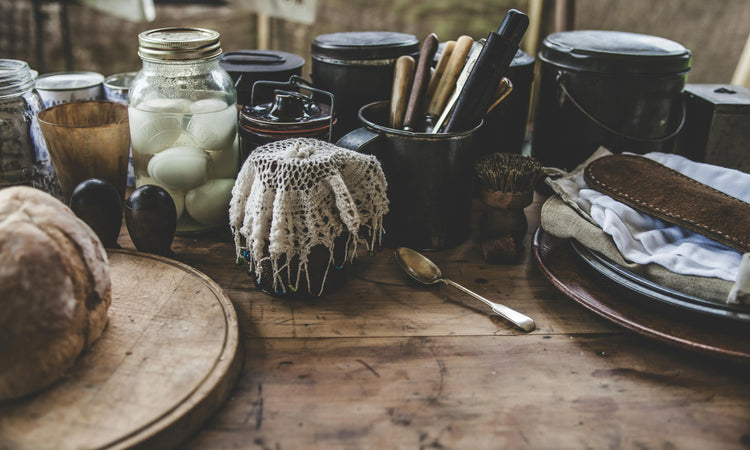 Wooden kitchen countertop covered in various jars